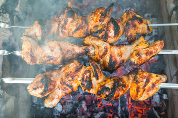 Chicken shish kebab roasting on the coals.