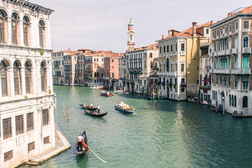 Fototapeta na wymiar Gondola and Modern boat on Canal grande of Venezia, Venice