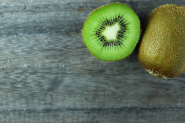 Fresh kiwi fruits on wooden background.Ripe kiwi fruits.