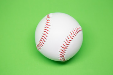 Baseball on green background