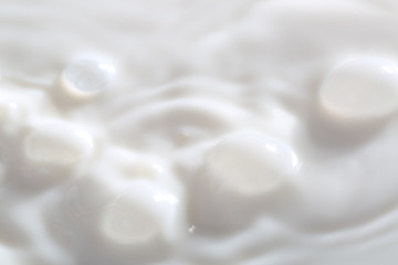 Fototapeta na wymiar Pouring Milk Splash. Close-up image.
