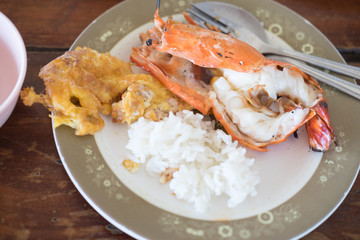 Thai Jasmine rice eating with shrimp and omelet