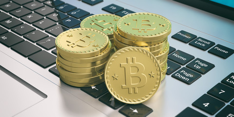 Bitcoins stack on a computer keyboard. 3d illustration