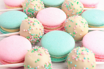 Closeup of colorful macaroons mixed with cake pops