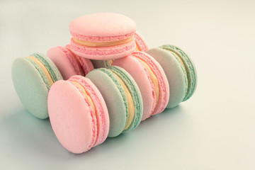 Assortment of mint and strawberry colorful macaroons with copy space