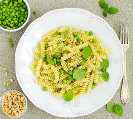 Fusilli pasta with young peas, parmesan and basil.