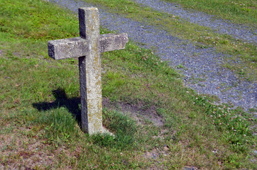 Stone cross in old cemetery 