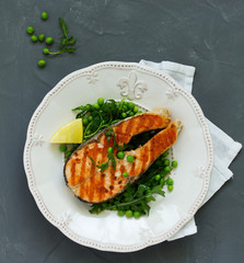baked fish or roasted fillet or steak with peas,