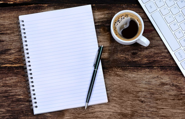  Empty notebook with coffee and keyboard computer