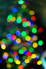 Defocused Christmas tree lights background. Colorful blurred lights with bokeh