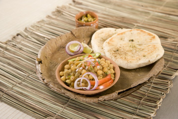 Matar kulcha or Dried yellow peas chaat with pan cooked bread