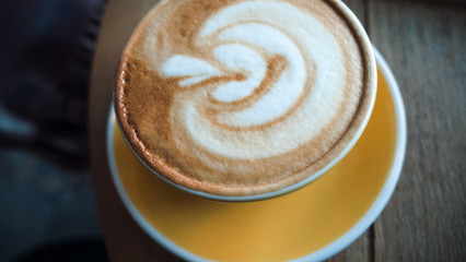 Beautiful coffee with leaf creme