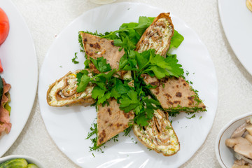 A fragrant liver cake, cut into pieces close-up.