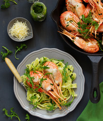 Fried king prawns, served with pasta tagliatelle.