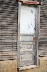 Old abandoned boarded up brick building