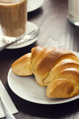 Continental Breakfast of Croissant Roll and Latte in a European Cafe
