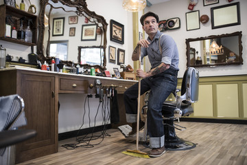 Barber shop, owner posing for pic