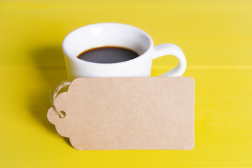 Cup of coffee with a tag
