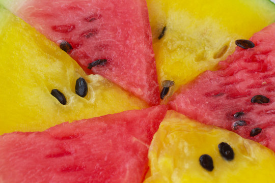 Slices of red and yellow watermelon. Closeup. Top view.