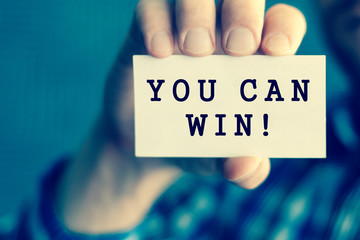 YOU CAN WIN, message on white card man showing, may used for different words and background. Aged...