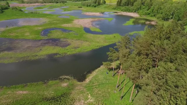 Flying over lake and flowers lake. Beautiful Russian nature. Aerial Hd slowmotion