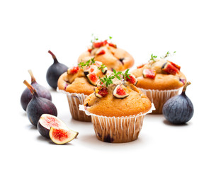 Baked  muffins with figs isolated on white