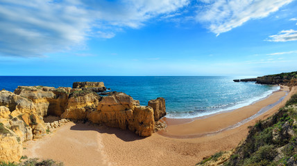 Yellow cliffs on beach (Algarve, Portugal).