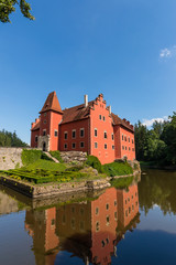Naklejka na ściany i meble Nice romantic castle with red color in the middle of lake