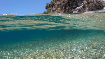 Half underwater close up, background split by waterline, Turkey, Mediterranean Sea,