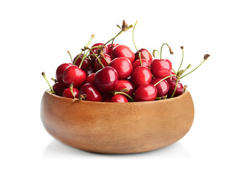 Bowl with fresh ripe cherries on white background