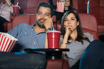 Couple watching a boring movie