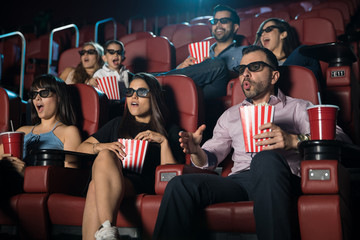 Surprised crowd watching 3d movie