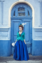 Beautiful caucasian girl dressed in rococo style