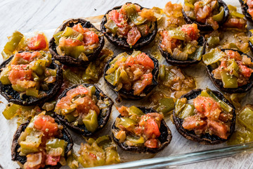 Baked Mushrooms stuffed with tomatoes and green pepper.