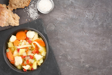 Homemade turkey soup in bowl on table