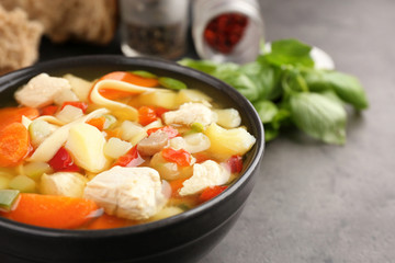 Homemade turkey soup in bowl on table