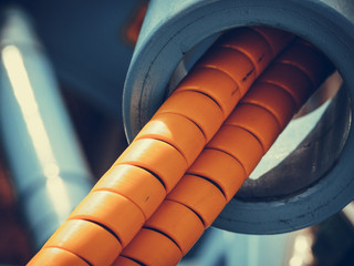 Tube wires in orange rubber cover casing