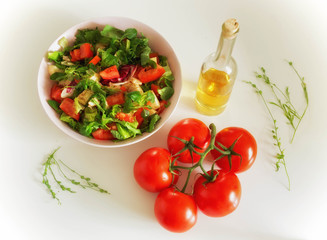 Vegetable salat with toppings such as mozzarella cheese, tomato, olive oil and spices