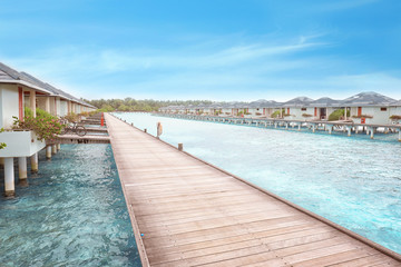 Fototapeta premium View of wooden pontoon and beach houses at sea resort