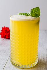 Persian Saffron Milkshake with basil leaves.