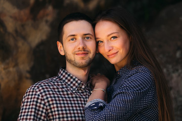 Beautiful couple close-up portrait looking into camera and smili