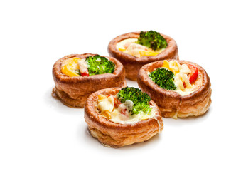 Yorkshire  puddings stuffed with broccoli and scrambled eggs isolated on white background