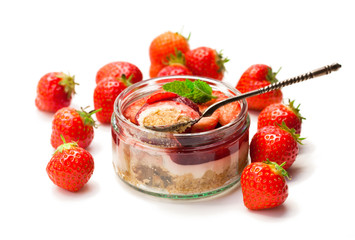 Mini  strawberry cheesecake in a glass pot isolated on white background