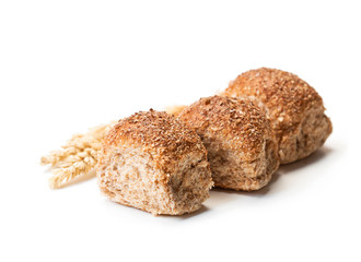 Mini  buns and wheat ears isolated on white background