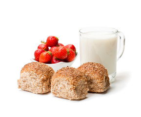 Mini  buns and mug of milk with strawberries isolated on white background
