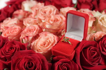 jewelry box with gold  ring on flowers