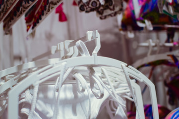 Closeup on clothing hangers, abstract background
