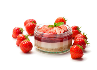 Mini  strawberry cheesecake in a glass pot isolated on white background