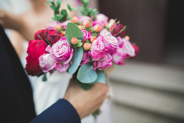 Obraz na płótnie Canvas Beautiful luxury wedding bouquet of red flowers