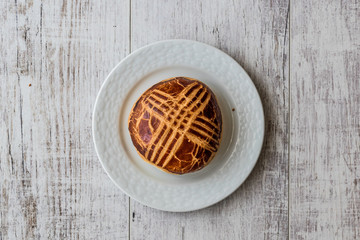 Turkish Pastries Pogaca on white wooden surface..